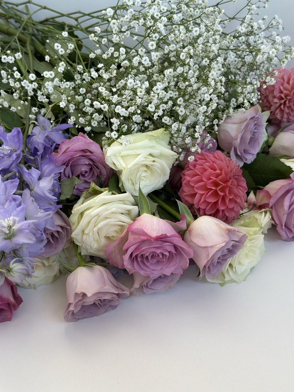 Close-up of pink, lavender and ivory flowers selected by Ava Floral Design
