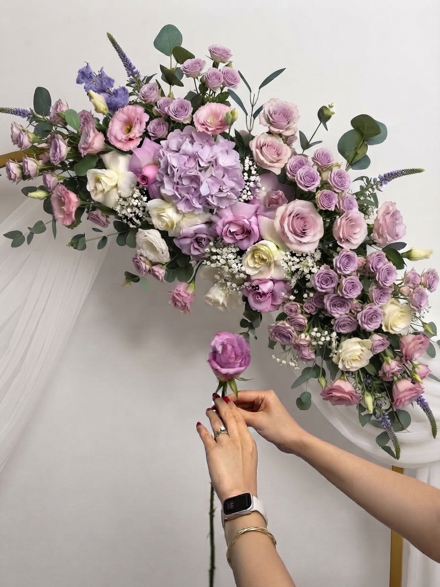 Ava arranging lavender and blush flowers by hand